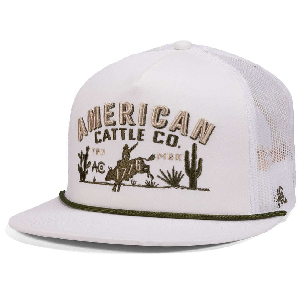 The 8-Second Hat by American Cattle Co is a white mesh back hat with "American Cattle Co." and a cowboy design on the front, “1776” below, plus an olive green accent rope above the brim.