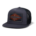 Introducing the Billboard Hat-Flat by Rural Cloth—a charcoal mesh-back rancher cap featuring a red and black diamond-shaped patch with the text “Certified Brand American Cattle Co. 76” and a bull head graphic above, complete with an adjustable snapback closure for a customizable fit.