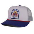 The Sundown Hat by Rural Cloth is a gray and blue western snapback trucker with mesh back, red rope above the brim, and a front patch showing cacti and 