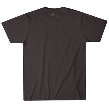 The ACC Longhorn Tee by American Cattle Co is a plain dark brown T-shirt shown from the back, featuring a small light "AC" copyright logo near the collar—ideal for fans of American Cattle Co or farm life enthusiasts.