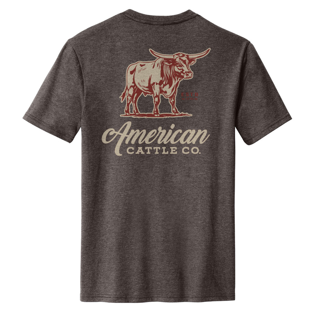 The Anchor Bull Tee by American Cattle Co is a dark gray western t-shirt with a longhorn steer graphic and “American Cattle Co.” in cream and red on the back.