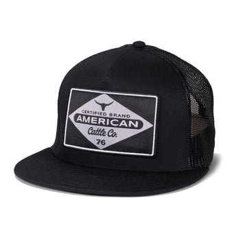 The American Cattle Co Billboard Hat-Flat is a black mesh trucker hat with a flat brim and a front patch featuring "Certified Brand American Cattle Co. 76" plus a bull logo—ideal for fans of classic rancher style.