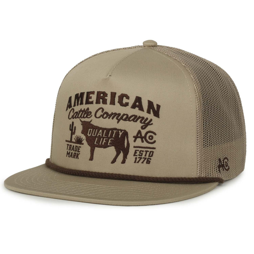 The Bull Crest Hat by American Cattle Co is a tan mesh trucker with a flat bill, high crown snapback style, and features embroidered "American Cattle Company," a cow graphic, and logos including "Quality Life," "Trade Mark," and "ESTD 1776.