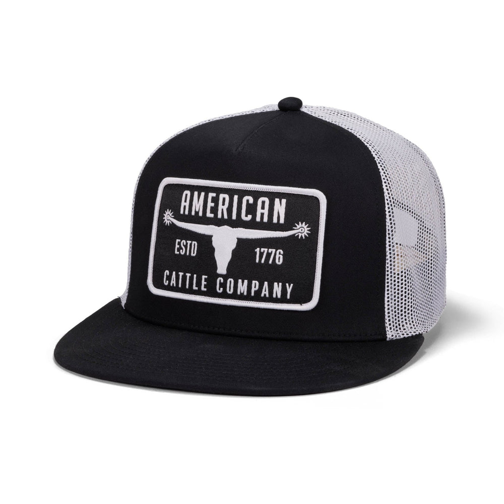 The American Cattle Co Bull Spurs Hat-Flat is a black and white mesh back snapback trucker hat with a front patch reading "AMERICAN CATTLE COMPANY ESTD 1776" and a steer head graphic at the center.
