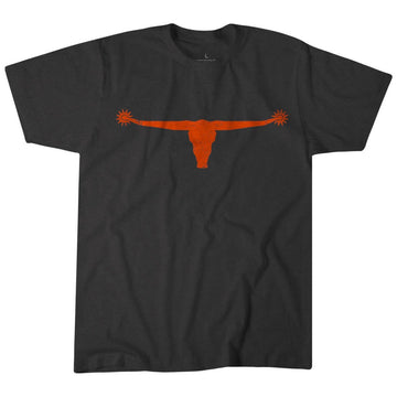 The Bull Spurs Icon Tee features a black design with an orange longhorn emblem and wide horns graphic centered on the chest, drawing inspiration from classic rural American style.