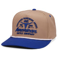 The Certified Ranchers Association Hat by Rural Cloth is a khaki and navy snapback with “American Cattle Company” and a steer skull logo embroidered on the front, plus a blue brim, blue button, and white rope above the brim.