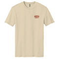 The Desert Longhorn Tee by American Cattle Co is a beige short-sleeve t-shirt with a small red and brown 