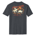 The Frontier Tee by American Cattle Co is a dark gray shirt with a vintage western vibe, featuring a cowboy herding cattle, mountain and cactus graphics, and bold red-orange 