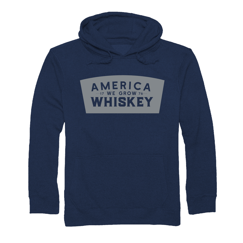 The Keystone Pullover by Rural Cloth is a navy blue hoodie featuring "AMERICA 17 WE GROW 76 WHISKEY" in white and gray—perfect for American whiskey fans.