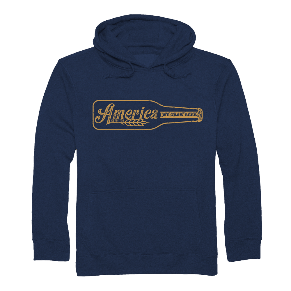 The Rural Cloth Longneck Pullover is a navy blue hoodie with a beer bottle illustration on the chest. Inside, “America We Grow Beer” and a wheat graphic are printed in vintage style, honoring American brewing culture.