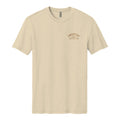 The On the Range Tee by Rural Cloth is a beige poly-cotton short-sleeve shirt with a small brown 