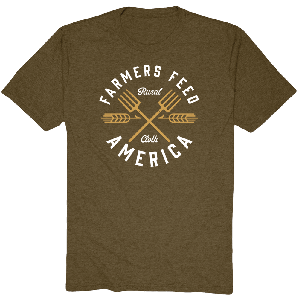 Support American agriculture in style with the olive green Pitchfork Tee by Rural Cloth, featuring white "Farmers Feed America" text, gold brand lettering, crossed pitchforks, and wheat stalks for a timeless look.