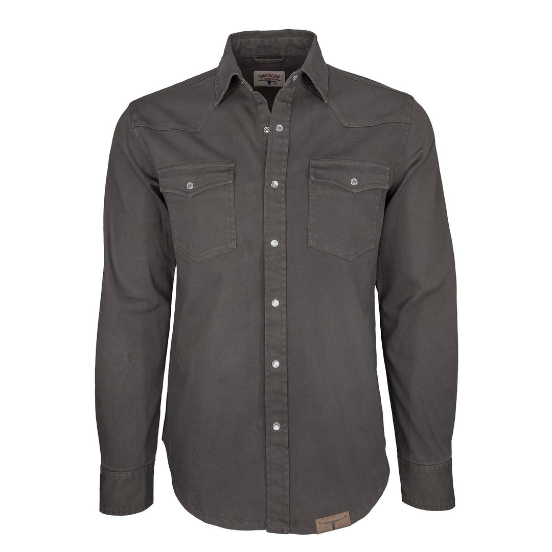 Introducing the Range Shirt by American Cattle Co, a long-sleeve, button-up shirt in the rich Thundercloud hue. It features two chest pockets, a classic collar, and eye-catching pearl snaps. Visible stitching and a straight hem add to its timeless style, while garment-dyed construction ensures exceptional depth of color.