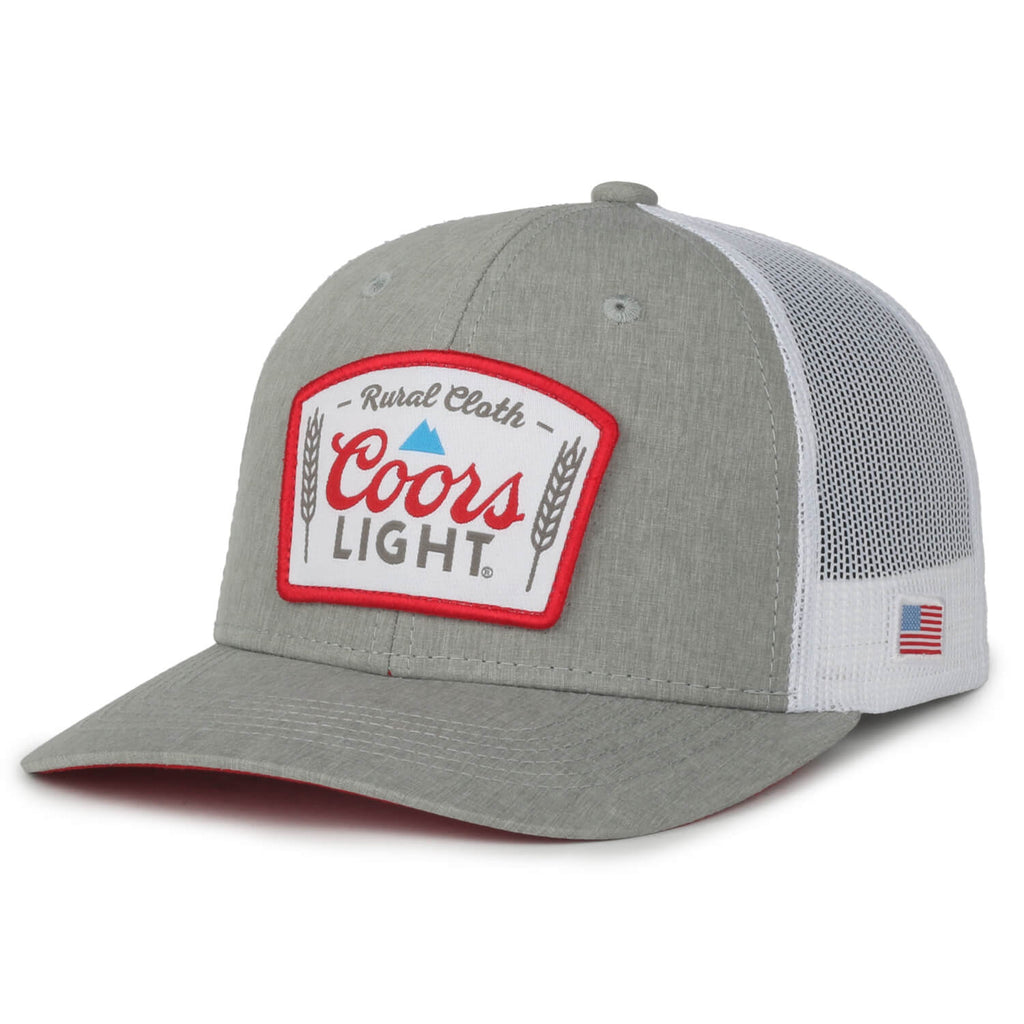 The Rc X CL Hat by Rural Cloth is a gray and white trucker hat with a mesh back, featuring an embroidered patch on the front that reads 