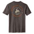 The Rodeo Star Tee by American Cattle Co is a heathered dark gray western shirt with a back graphic of a bronc rider atop a bucking bull, framed by 