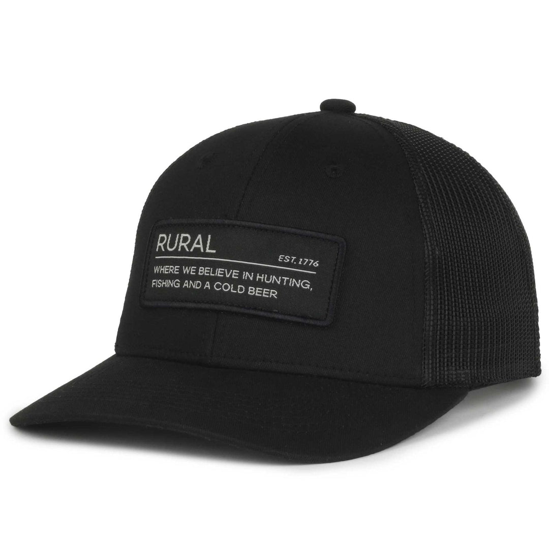 Rural Def Hat in black — snapback with mesh back and front patch reading RURAL, EST. 1776, WHERE WE BELIEVE IN HUNTING, FISHING AND A COLD BEER.