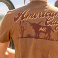 A person wearing the Rural Cloth Shadowhorn Tee, featuring 