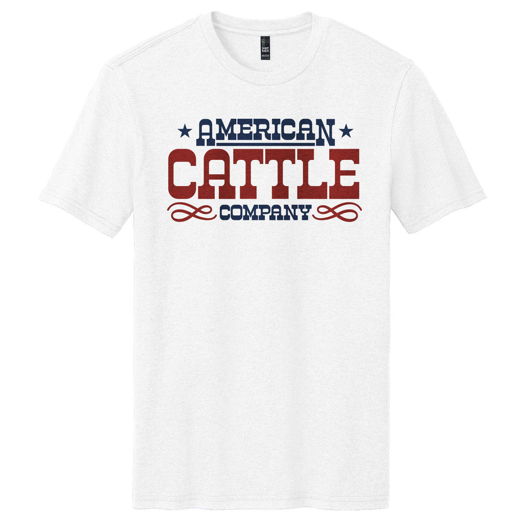 The Showstock Tee by American Cattle Co is a classic fit white T-shirt with "American Cattle Company" printed in bold red and blue letters, decorated with stars and stylish flourishes.