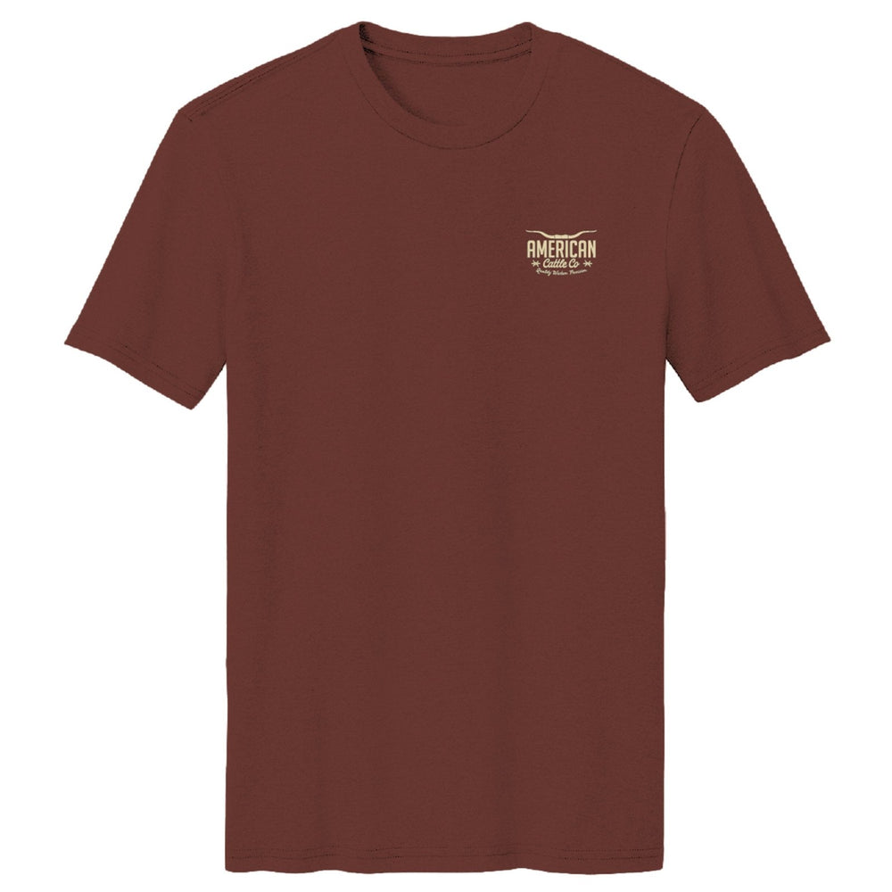 The Stockyard Tee by American Cattle Co is a classic fit maroon soft cotton short-sleeve shirt with a small beige “American Road Trip” wing logo on the left chest, inspired by vintage cattle tee designs.
