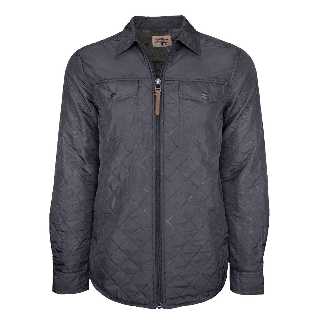Introducing the Sunday Jacket by American Cattle Co, crafted in a striking Thundercloud gray. This quilted shirt jacket features a diamond-patterned fabric, front zipper closure, and two chest pockets with button flaps. Designed with a classic pointed collar and long sleeves with adjustable cuffs, it also includes a soft Polar Fleece lining for extra comfort and warmth.