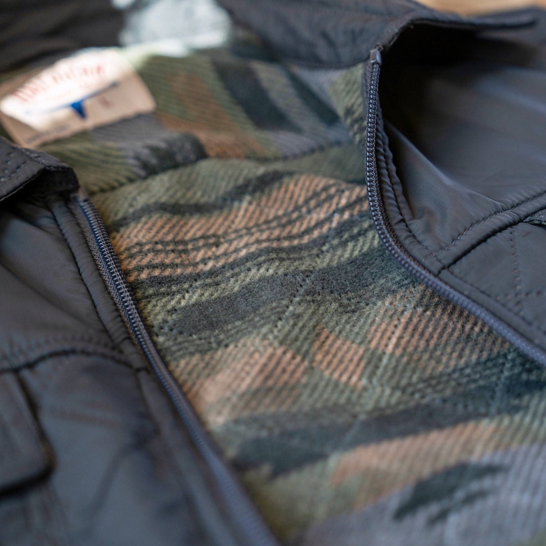 Open front of the Sunday Jacket in Thundercloud showing the geometric-pattern Polar Fleece lining and zipper.