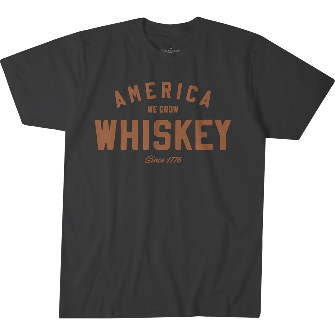 The Rural Cloth Whiskey Tee is a premium black shirt with “America We Grow Whiskey Since 1776” in bold brown letters—ideal for any whiskey fan.