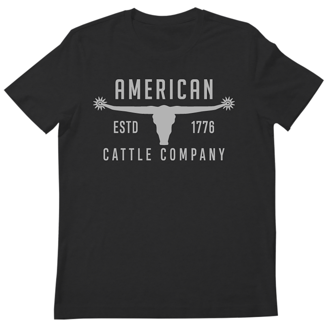 A rugged Western t-shirt, the Bull Spurs Tee-Black Frost features a black design with a striking longhorn skull graphic and “American Cattle Company ESTD 1776” text—perfect for anyone seeking that classic Bull Spurs style.