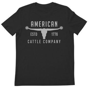 A rugged Western t-shirt, the Bull Spurs Tee-Black Frost features a black design with a striking longhorn skull graphic and “American Cattle Company ESTD 1776” text—perfect for anyone seeking that classic Bull Spurs style.