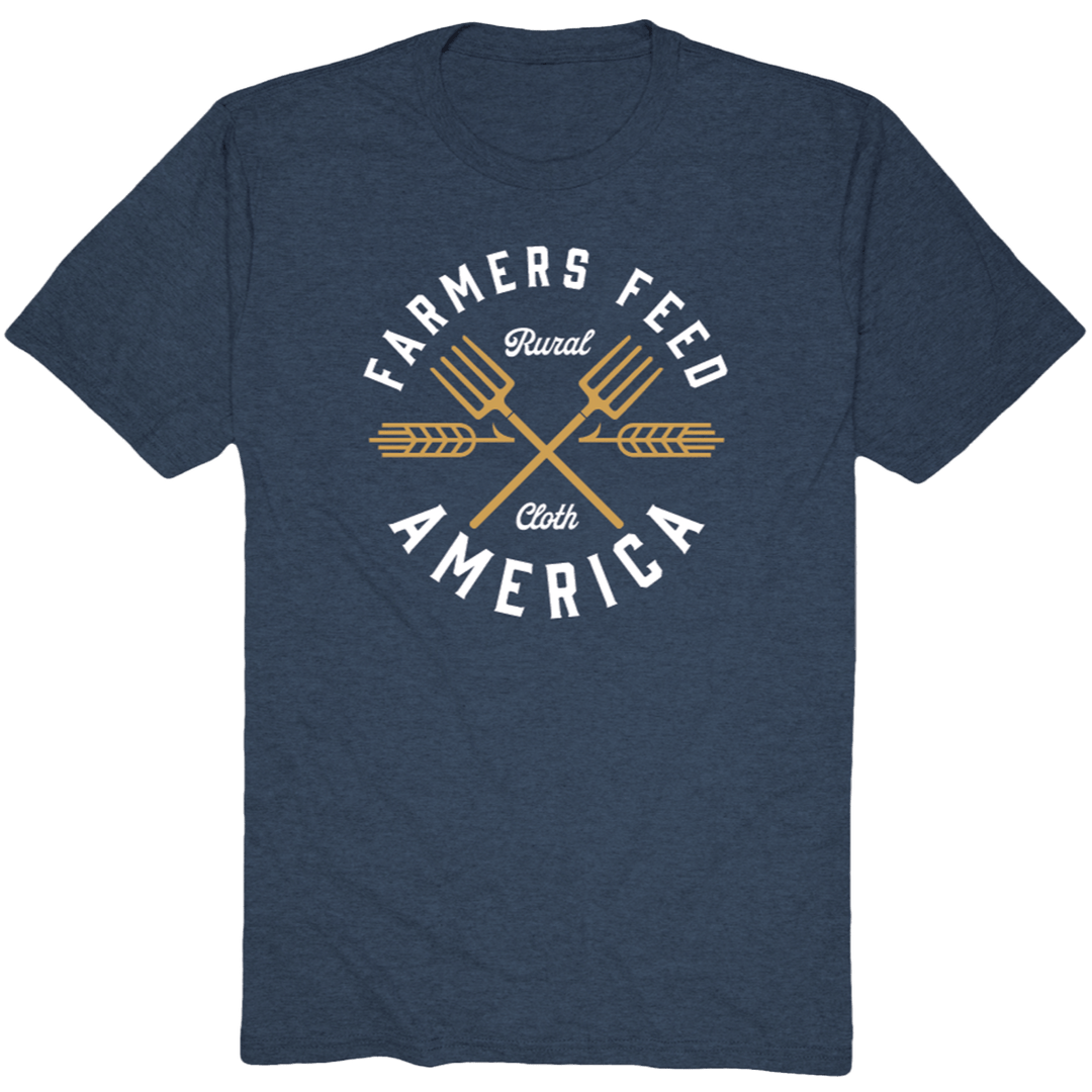 Show your support for American agriculture with the Rural Cloth Pitchfork Tee, a blue shirt featuring two golden pitchforks and bold "Farmers Feed America" text, with "Rural Cloth" elegantly scripted between the crossed pitchforks.