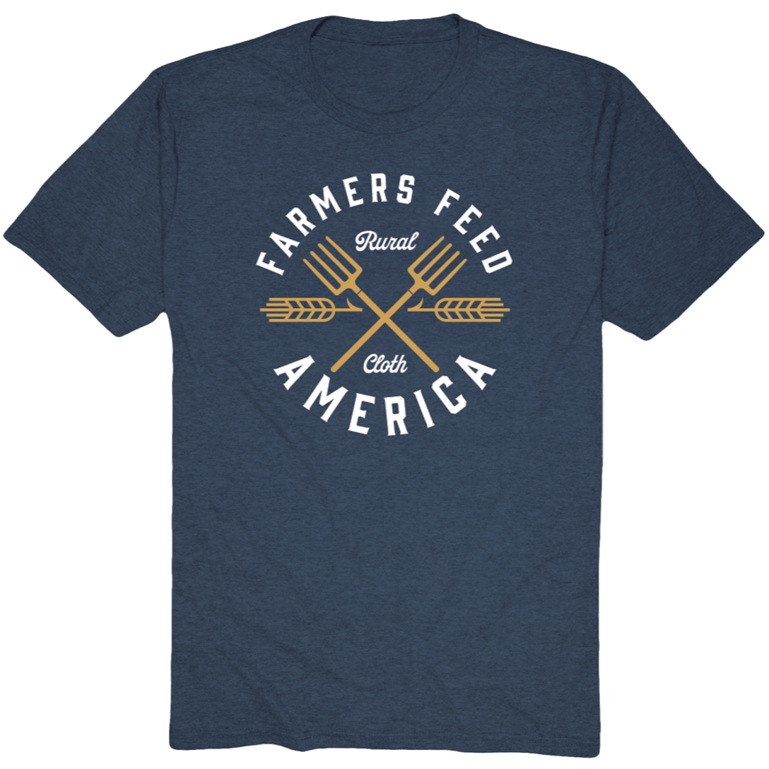 Show your support for American agriculture with the Rural Cloth Pitchfork Tee, a blue shirt featuring two golden pitchforks and bold "Farmers Feed America" text, with "Rural Cloth" elegantly scripted between the crossed pitchforks.