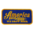 The We Grow Beer Patch by Rural Cloth is a vintage-style rectangular blue patch featuring a yellow border and text. It reads 